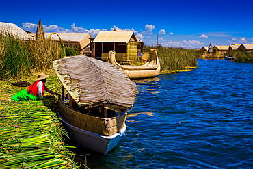 Quechua Indian family on Floating Grass islands of Uros, Lake Titicaca, Peru, South America