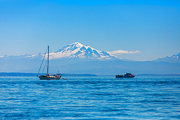 Whale watching boats off the coast of Orcas Island overlooking Mount Baker, Washington State, United States of America, North America