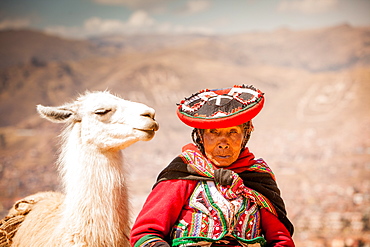 Traditional Peruvian woman and her llama, Cusco, Peru, South America