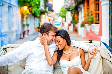 Couple sitting in a horse and carriage, Old Walled-in City, Cartagena, Colombia, South America