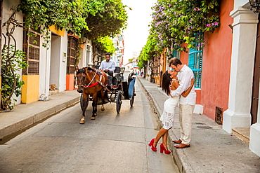 Couple posing in the street, Old Walled-in City, Cartagena, Colombia, South America