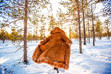 Woman in fur coat in the Arctic Wilderness, Kakslauttanen Igloo West Village, Saariselka, Finland, Scandinavia, Europe