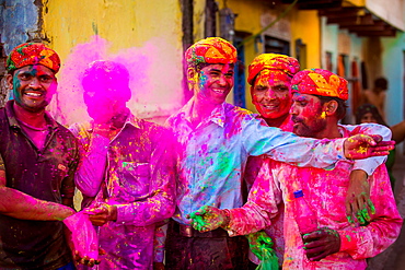 Men throwing colored pigment, Holi Festival, Vrindavan, Uttar Pradesh, India, Asia