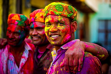 Men throwing colored pigment, Holi Festival, Vrindavan, Uttar Pradesh, India, Asia