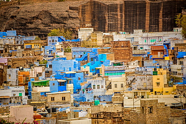 Mehrangarh Fort towering over the blue rooftops in Jodhpur, the Blue City, Rajasthan, India, Asia