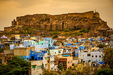 Mehrangarh Fort towering over the blue rooftops in Jodhpur, the Blue City, Rajasthan, India, Asia