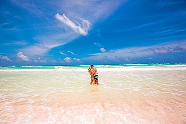 Romantic couple on the beach of Tulum, Mexico, North America