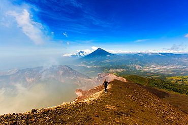 Cresting the peak of Pacaya Volcano in Guatemala City, Guatemala, Central America