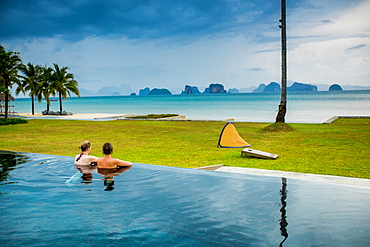 Couple relaxing in the pool on Koh Yao Noi Island, Thailand, Southeast Asia, Asia