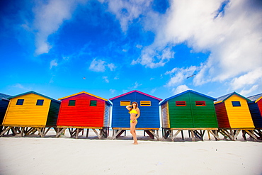 Girl in bikini, colorful beach huts, Muizenberg Beach, Cape Town, South Africa, Africa