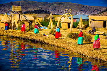 Quechua Indian family on Floating Grass islands of Uros, Lake Titicaca, Peru, South America