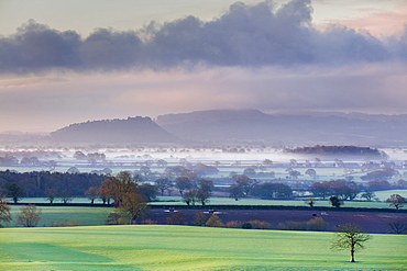 Low winter light rakes across the Cheshire plain with Beeston Castle and the Peckforton sandstone ridge beyond, Cheshire, England, United Kingdom, Europe