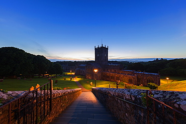 The historic St. David's Cathedral and Bishops Palace nestled in a natural valley at dusk in Pembrokeshire, Wales, United Kingdom, Europe