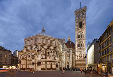 The Florence Campanile and Cathedral in the early evening with people walking around the Piazza Di San Giovanni, Florence, UNESCO World Heritage Site, Tuscany, Italy, Europe