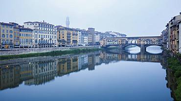 The Ponte Vecchio on the Arno River on a misty morning with the Palazzo Vecchio shrouded in mist, Florence, UNESCO World Heritage Site, Tuscany, Italy, Europe