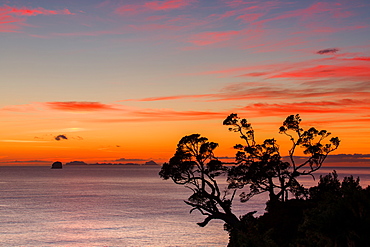 A dawn sky above the Alderman Islands in the South Pacific from New Zealand's Coromandel Peninsula, Waikato, North Island, New Zealand, Pacific