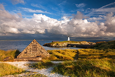 Boathouse and Twr Mawr lighthouse on Llanddwyn Island, Anglesey, Wales, United Kingdom, Europe