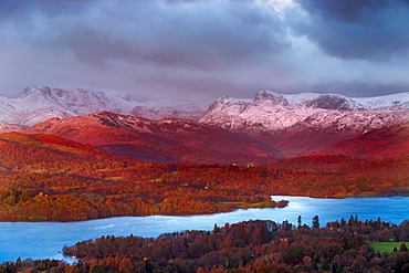 Looking across Lake Windermere to the snow capped Langdale Pikes on a winters morning in the Lake District National Park, Cumbria, England, United Kingdom, Europe