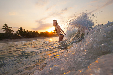 A girl plays in the waves at Palomino on the Caribbean coast of Colombia, South America