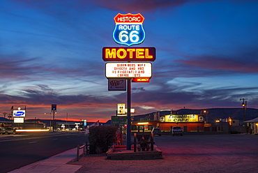 Historic Route 66 neon sign glowing at sunset, Seligman, Arizona, United States of America, North America