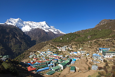 Namche, the main trading centre and tourist hub for the Khumbu (Everest region) with Kongde Ri peak, 6187m, in the background, Himalayas, Nepal, Asia