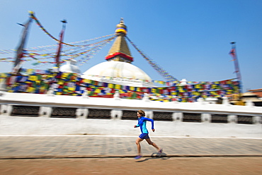 Marathon Ultra Runner Lizzy Hawker running around Bouddha (Boudhanath) (Bodnath) Stupa in Kathmandu, Nepal, Asia