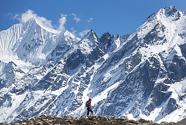 Trekking in the Langtang Valley with a view of Ganchempo in the distance, Langtang Region, Himalayas, Nepal, Asia