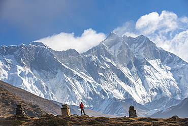 A trekker on his way to Everest Base Camp with Everest the distant peak on the left and Lhotse the peak on the right, Khumbu Region, Himalayas, Nepal, Asia