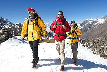 A team of four climbers return to base camp after climbing Ama Dablam in the Nepal Himalayas, Khumbu Region, Nepal, Asia