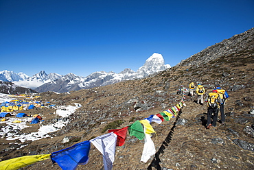 A team of four climbers return to base camp after climbing Ama Dablam in the Nepal Himalayas, Khumbu Region, Nepal, Asia