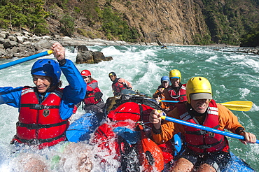 Rafters get splashed as they go through some big rapids on the Karnali River, west Nepal, Asia