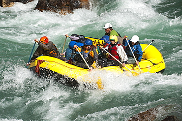 Rafters get splashed as they go through some big rapids on the Karnali River, west Nepal, Asia