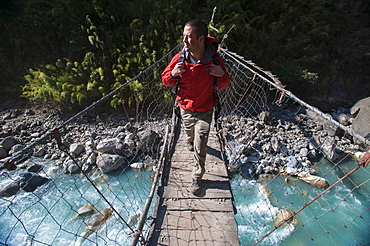 A wire suspension bridge across the Gandaki River, Manaslu Region, Nepal, Asia