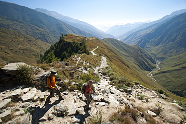 Trekkers make their way east down the Juphal Valley in Lower Dolpa in west Nepal, Himalayas, Nepal, Asia