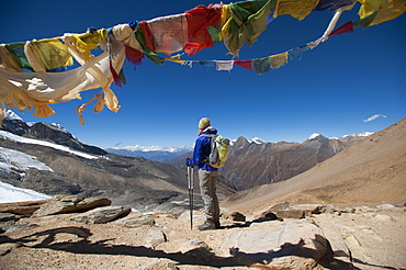 A windy prayer flag strewn cairn marks the top of the Kagmara La, the highest point in the Kagmara Valley at 5115m, Dolpa Region, Himalayas, Nepal, Asia