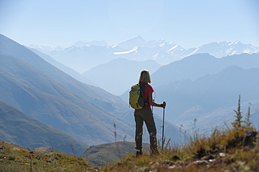 Taking a pause from the trail at a viewpoint in the Juphal valley in the remote Dolpa region, Himalayas, Nepal, Asia