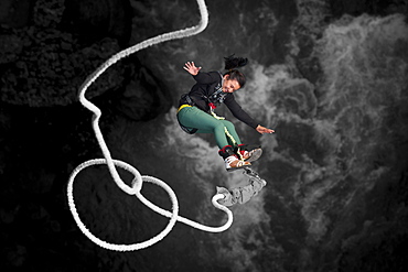 A Nepali girl bungy jumping at The Last Resort in Nepal, Asia