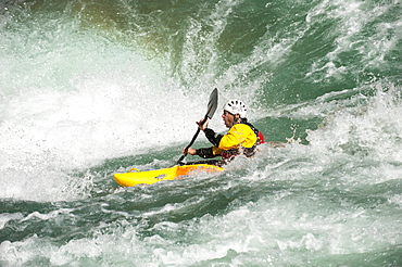 A kayaker negotiates his way through the rapids on the Karnali River, west Nepal, Asia