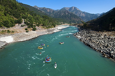 Rafts and kayaks drift down the Karnali River in west Nepal, Asia