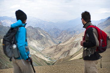 Stopping to savour the views from the top of the Konze La, 4900m, during the Hidden Valleys trek, Ladakh, India, Asia