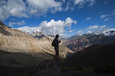 Stopping to savour the views from the top of the Dung Dung La during the Hidden Valleys trek in Ladakh, a remote Himalayan region, India, Asia