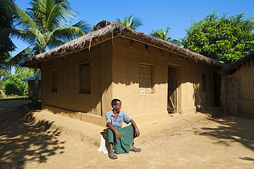 A man sitting outside his house in the Chittagong Hill Tracts, Bangladesh, Asia