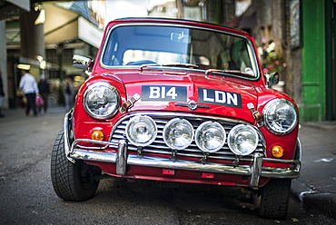 A classic red Mini Cooper parked outside Borough Market in London, England, United Kingdom, Europe