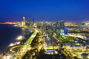 Skyline and Corniche, Al Markaziyah district by night, Abu Dhabi, United Arab Emirates, Middle East