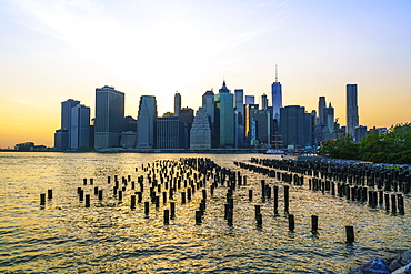 Lower Manhattan skyline across the East River at sunset, New York City, New York, United States of America, North America