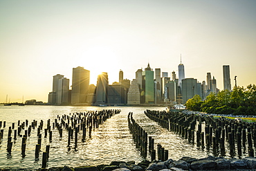 Lower Manhattan skyline across the East River at sunset, New York City, New York, United States of America, North America