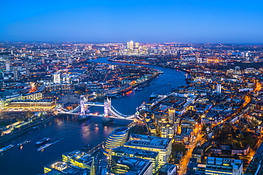 High view of London skyline at dusk along the River Thames from Tower Bridge to Canary Wharf, London, England, United Kingdom, Europe