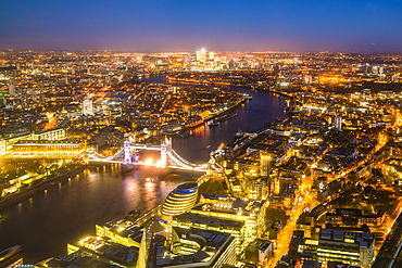 High view of London skyline at night along the River Thames from Tower Bridge to Canary Wharf, London, England, United Kingdom, Europe