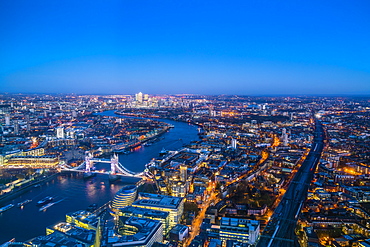 High view of London skyline at dusk along the River Thames from Tower Bridge to Canary Wharf, London, England, United Kingdom, Europe