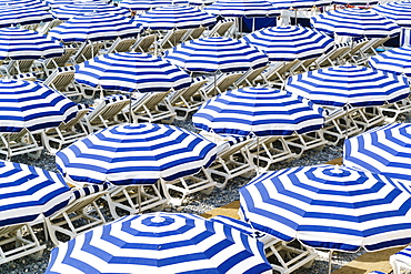 Blue and white beach parasols, Nice, Alpes Maritimes, Cote d'Azur, Provence, France, Mediterranean, Europe